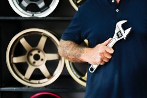 Customer service: Mechanic with wrench